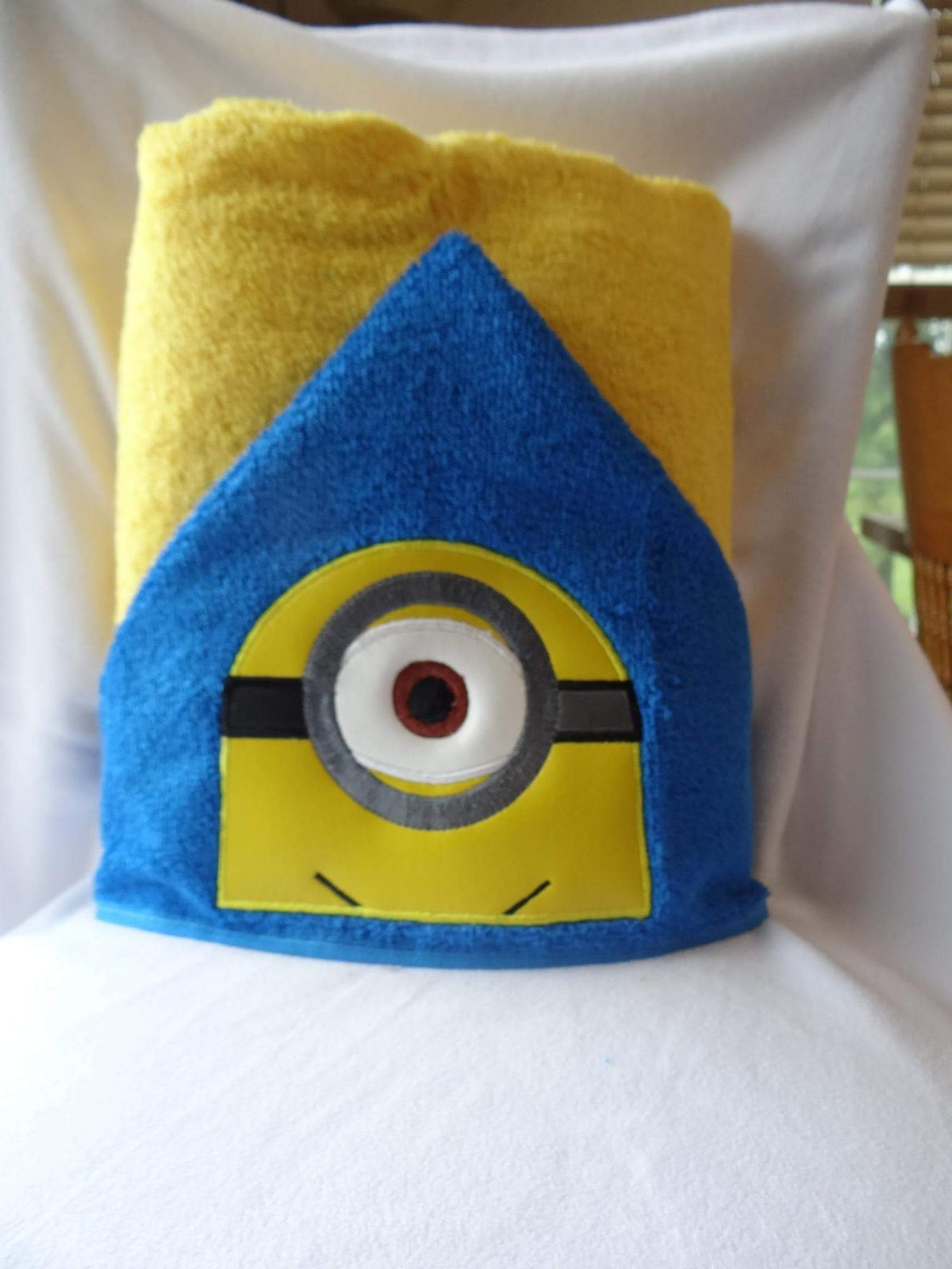 Hooded towel yellow goggle buddy design appliqué