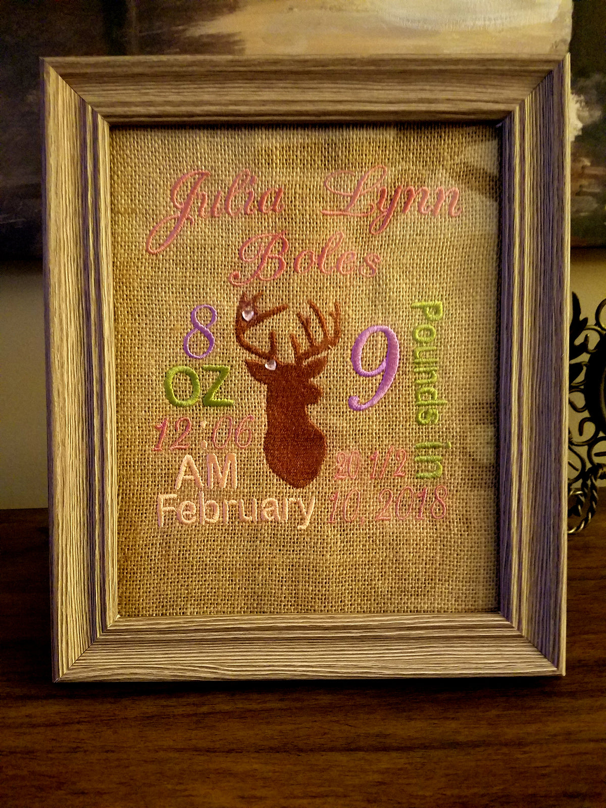 Framed embroidered burlap birth announcement with baby's birth details