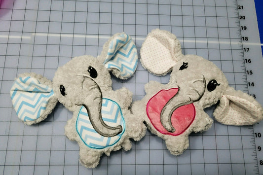 Handmade stuffed elephant plushies with custom colored ears and bellies