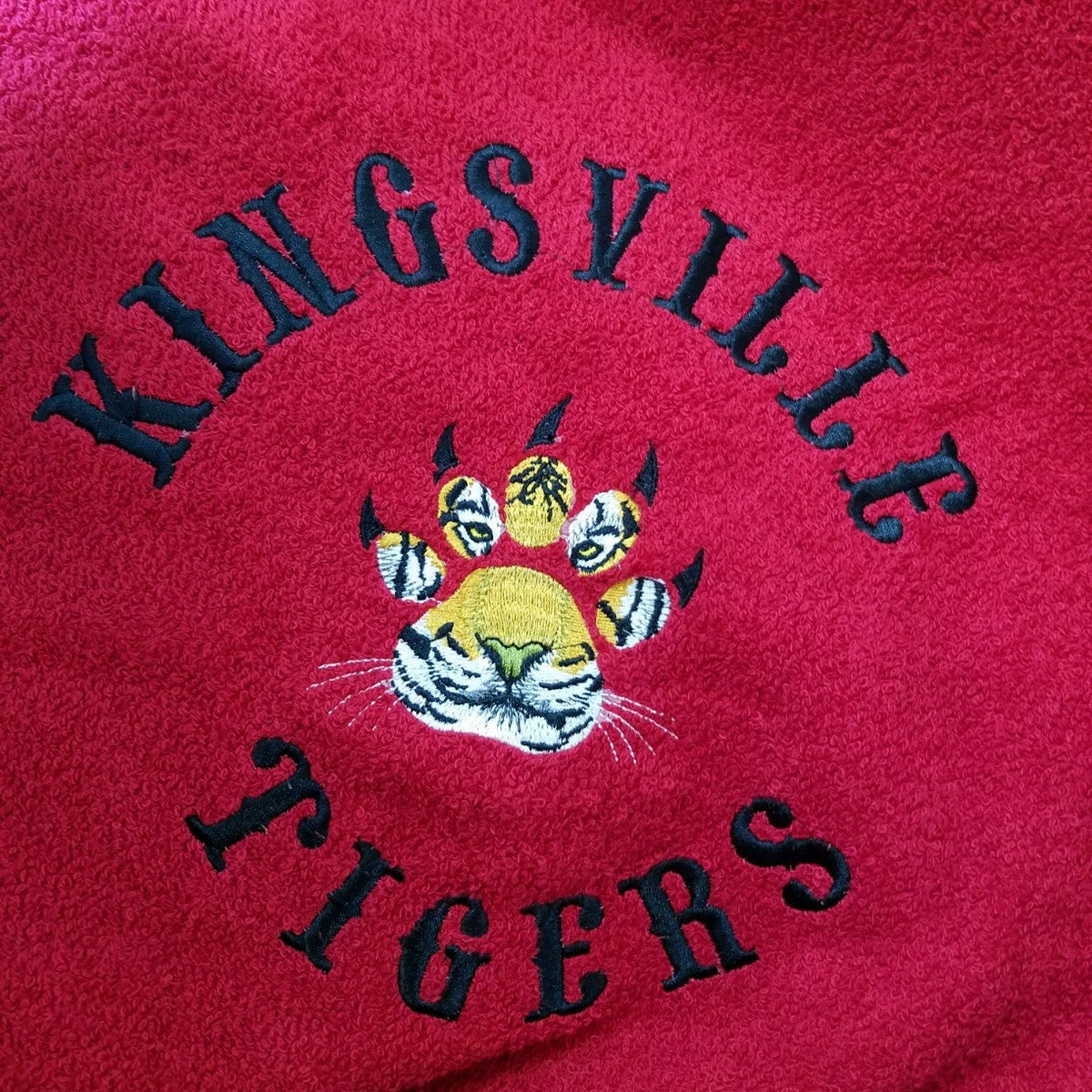 Hooded towel with Kingsville Tigers school logo embroidery, recentered