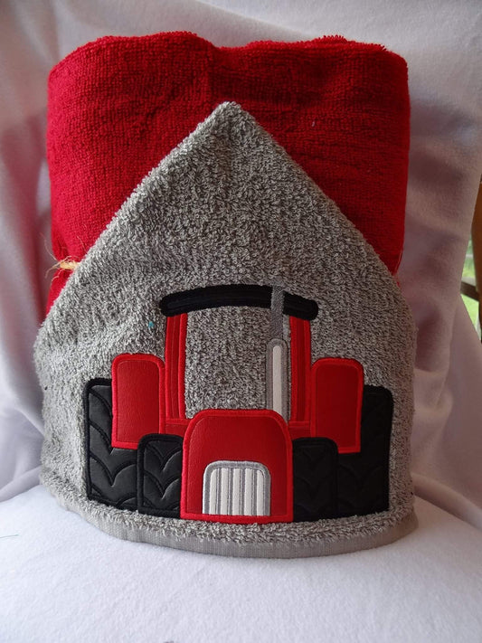 Hooded towel red tractor design appliqué
