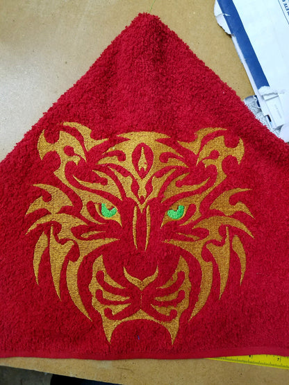 Hooded towel with tribal tiger head design, custom school logo example