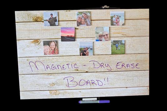 Magnetic dry erase board holding photo magnets and notes